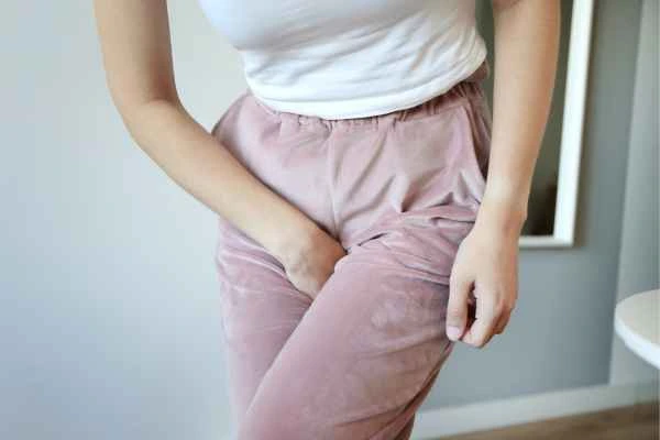 woman running for the toilet because of urinary incontinence Hereford